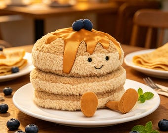 The cute muffin plush toy, with syrup and blueberries, is a stuffed animal gift containing breakfast foods.