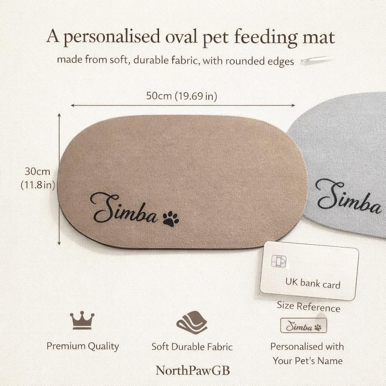 May include: A personalized oval pet feeding mat, 19.69 inches long and 11.8 inches wide, made of soft, durable fabric. The mat is beige with the name "Simba" and a paw print. The text "NorthPawGB" is also visible.