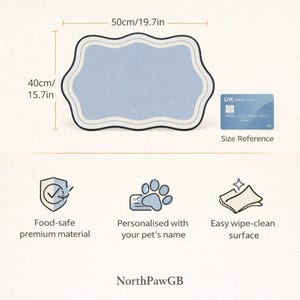 May include: A pale blue pet placemat, measuring 50cm long and 40cm wide, with a decorative wavy border. Features include food-safe material, a wipe-clean surface, and personalization for your pet's name. A UK bank card is shown for size reference.