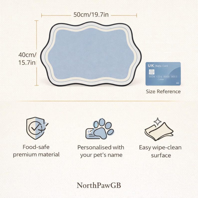 May include: A pale blue pet placemat, measuring 50cm long and 40cm wide, with a decorative wavy border. Features include food-safe material, a wipe-clean surface, and personalization for your pet's name. A UK bank card is shown for size reference.