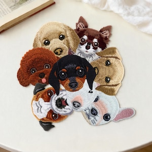 May include: A collection of embroidered dog patches, including a poodle, chihuahua, and dachshund. The patches are intricately stitched and feature a range of colours, such as brown, black, and white. These patches are suitable for customising clothing or accessories.