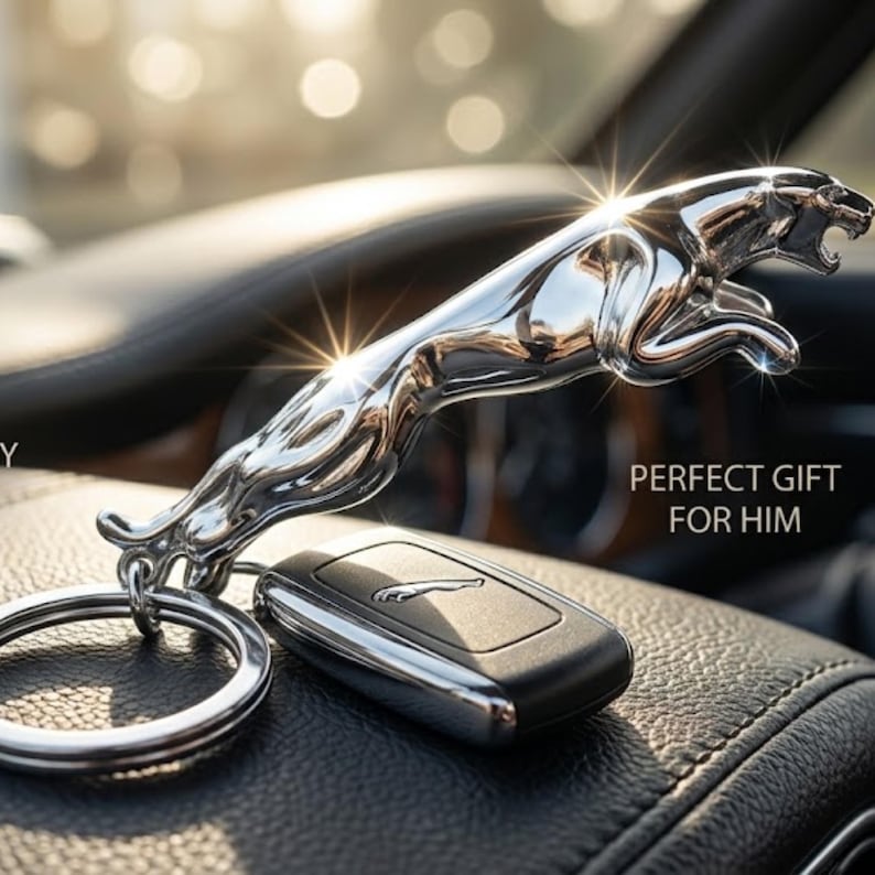 May include: A chrome-finished jaguar keychain with a matching car key. The keychain features a detailed jaguar figurine, attached to a silver keyring. The car key is black with a silver jaguar logo.