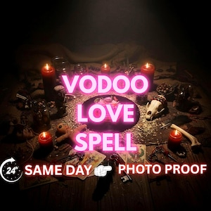 May include: A dimly lit scene with the words "VOODOO LOVE SPELL" in bright pink neon. The image includes lit red candles, a skull, keys, and other ritualistic items on a wooden surface. Text reads "SAME DAY PHOTO PROOF".