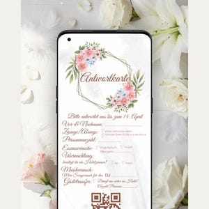 May include: A digital RSVP card displayed on a smartphone screen featuring a floral wreath graphic, the text "Antwortkarte," and fields for guest details, meal preferences, accommodation, music requests, and a brown QR code at the bottom.
