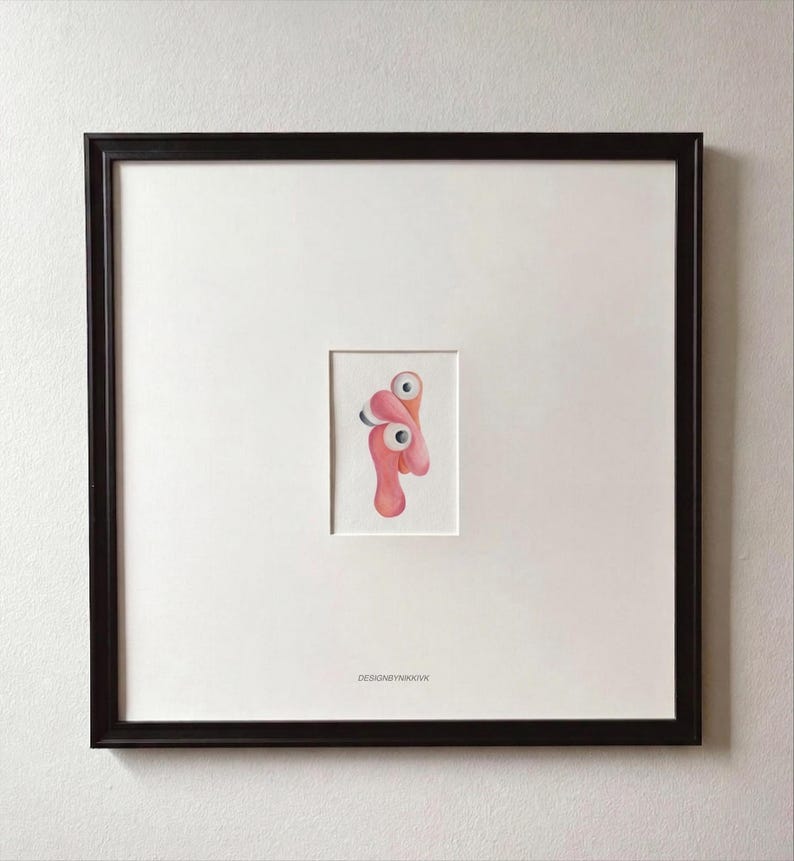 May include: A set of three ceramic mugs with a speckled, cream-colored glaze. Each mug features a different hand-painted design: a blue and green leaf, a yellow flower, and a red berry. The mugs have a simple, rounded shape.