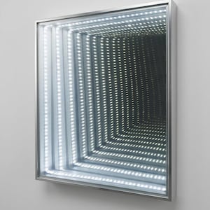 May include: Square infinity mirror with a silver frame. The mirror features rows of bright white LED lights, creating a seemingly endless tunnel effect. The design is modern and artistic, suitable for wall decor.