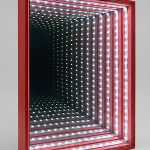 May include: Red-framed infinity mirror with a rectangular design. The mirror features rows of white LED lights that create a seemingly endless tunnel effect. The frame is a solid, vibrant red.