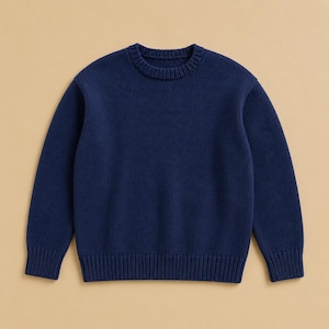 May include: A solid navy blue long-sleeve sweater featuring a classic crew neckline. The garment is constructed with a thick, textured knit pattern and includes ribbed detailing along the collar, sleeve cuffs, and the bottom hemline of the sweater.