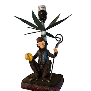 Lámpara decorativa vintage única de 1999 con forma de mono botones sosteniendo plátanos y un bastón. ¡FUNCIONA!
