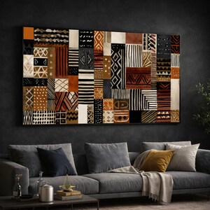 May include: A large rectangular wall art piece featuring a grid of various geometric patterns in shades of black, white, cream, and terracotta brown. The composition consists of multiple square and rectangular blocks, each displaying unique lines, dots, triangles, and chevron motifs arranged in a structured, patchwork-style layout.