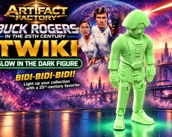 May include: A light green glow-in-the-dark Twiki figure from Buck Rogers in the 25th Century. The packaging features the text Artifact Factory, Buck Rogers in the 25th Century, Twiki, Glow in the Dark Figure, Bidi-Bidi-Bidi!, and Light up your collection.
