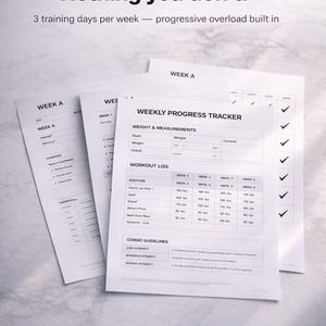 May include: White printed workout tracker sheets with text: "Everything you need. Nothing you don't." and "Weekly Progress Tracker." Includes sections for weight, measurements, and workout logs. The sheets are on a white background.