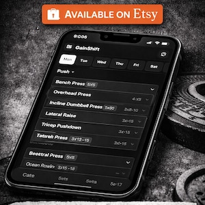 May include: A smartphone screen showing a fitness tracker app with workout details. The app, labelled "GainShift," displays exercises such as Bench Press and Overhead Press. The screen also displays the text "NOTION FITNESS TRACKER" and "PLAN YOUR WORKOUTS" and "TRACK YOUR PROGRESS."