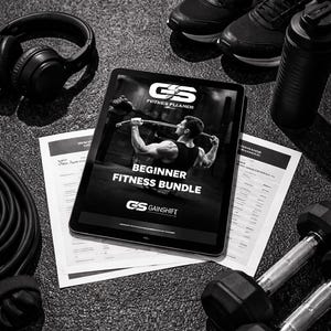 May include: A monochrome image showing fitness equipment and the text "DIGITAL DOWNLOAD". It features a tablet with a "Beginner Fitness Bundle" and "GS Gainshift" logo, alongside dumbbells, headphones, trainers, and a water bottle.