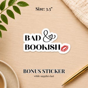 May include: A white sticker with the words "BAD & BOOKISH" in a bold, black font, with a red lipstick kiss graphic. The sticker is 3.5 inches in size.