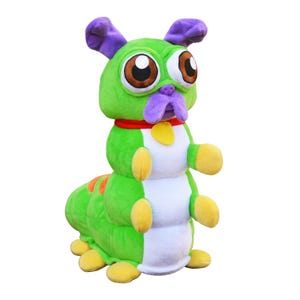May include: A plush toy shaped like a green caterpillar with a dog-like head, featuring large brown eyes, purple ears and snout, a red collar with a yellow tag, white belly segments, yellow feet, and orange stripes on its back.