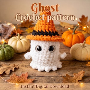 May include: A white crocheted ghost plushie wearing an orange and black pointed hat with large black safety eyes. The text Ghost Crochet pattern and Instant Digital Download are visible. The ghost is surrounded by small pumpkins and autumn leaves.