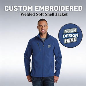 May include: A blue soft shell jacket with a zipper closure and a small logo on the chest. The jacket has a high collar and a round patch that says "YOUR DESIGN HERE". The text "CUSTOM EMBROIDERED Welded Soft Shell Jacket" is at the top.