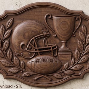 May include: A dark brown wooden wall plaque featuring a carved relief of an American football helmet, a football, and a trophy cup, all framed by two laurel branches. The rectangular plaque has scalloped edges and the text Digital Download - STL.