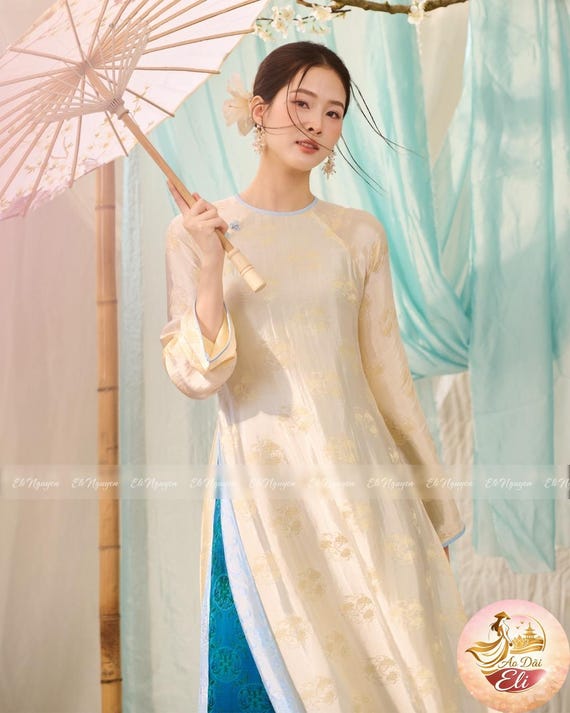 Ivory Silk Brocade Ao Dai with Teal Trousers – Floral Vietnamese Traditional Dress
