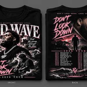 May include: A black t-shirt featuring a Rod Wave graphic. The front displays the artist, the text "DON'T LOOK DOWN," "2026 TOUR," and "HEALING HEARTS, CHANGING LIVES." The back shows the artist, "DON'T LOOK DOWN," a tour date list, and "THANK YOU FOR RIDING THE WAVE."