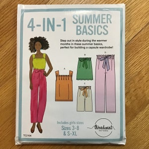 May include: A sewing pattern for "4-IN-1 SUMMER BASICS" shows illustrations of summer clothing. The pattern includes a tank top, shorts, and trousers in different colours. The pattern is for girls sizes 3-8 and S-XL.
