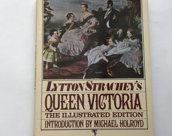 May include: A hardcover book titled "Lytton Strachey's Queen Victoria: The Illustrated Edition." The cover features a historical painting of Queen Victoria and her family. The book's title is in a burgundy font.