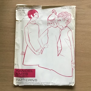 May include: A vintage sewing pattern for a basic dress with darts. The pattern is from Kandel Knits and is for sizes 8 to 16. The pattern is printed on white paper with pink ink and features a line drawing of three women wearing the dress. The pattern is titled "Omni Basic Dress with Basic Darts" and is pattern number 9. The pattern is priced at $2.50.