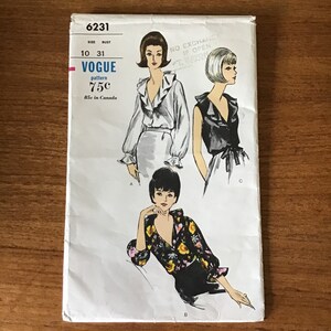 May include: Vintage Vogue sewing pattern featuring illustrations of blouses. The pattern number is 6231, with sizes 10 and bust 31. The price is 75 cents in the US and 85 cents in Canada. The cover shows three blouse designs.