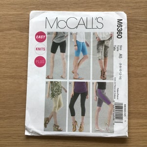 May include: McCall's M6360 sewing pattern for knit shorts and leggings. The pattern includes sizes A5 (6-8-10-12-14). The cover features illustrations of different styles of shorts and leggings in various colours.