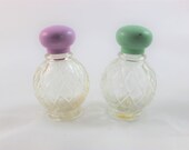 Two Vintage Avon Perfume Bottles with Aqua and Pink Tops
