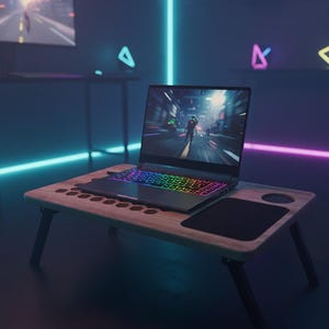 May include: A laptop with a rainbow-lit keyboard sits on a wooden lap desk with black legs. The laptop displays a video game scene. A black mousepad and a cup holder are on the desk.