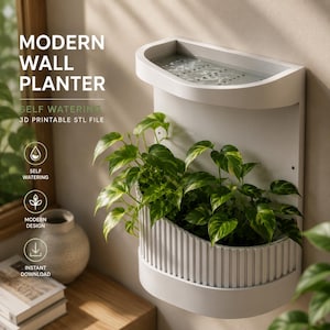 May include: A white wall-mounted planter with a self-watering reservoir at the top and a ribbed lower section containing a green leafy plant. The text reads MODERN WALL PLANTER, SELF WATERING, 3D PRINTABLE STL FILE, SELF WATERING, MODERN DESIGN, INSTANT DOWNLOAD.