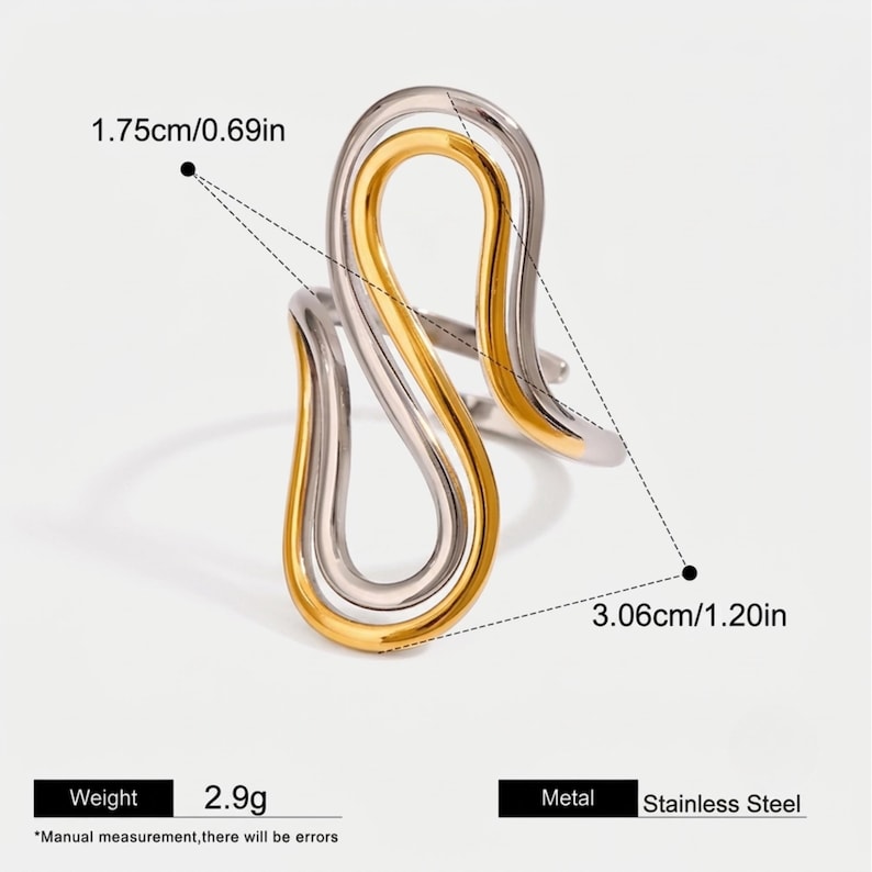 May include: A stainless steel ring featuring an abstract, flowing S-shaped design in silver and gold tones. The ring measures 1.75 cm or 0.69 inches in width and 3.06 cm or 1.20 inches in height, with a total weight of 2.9 grams as indicated in the text.
