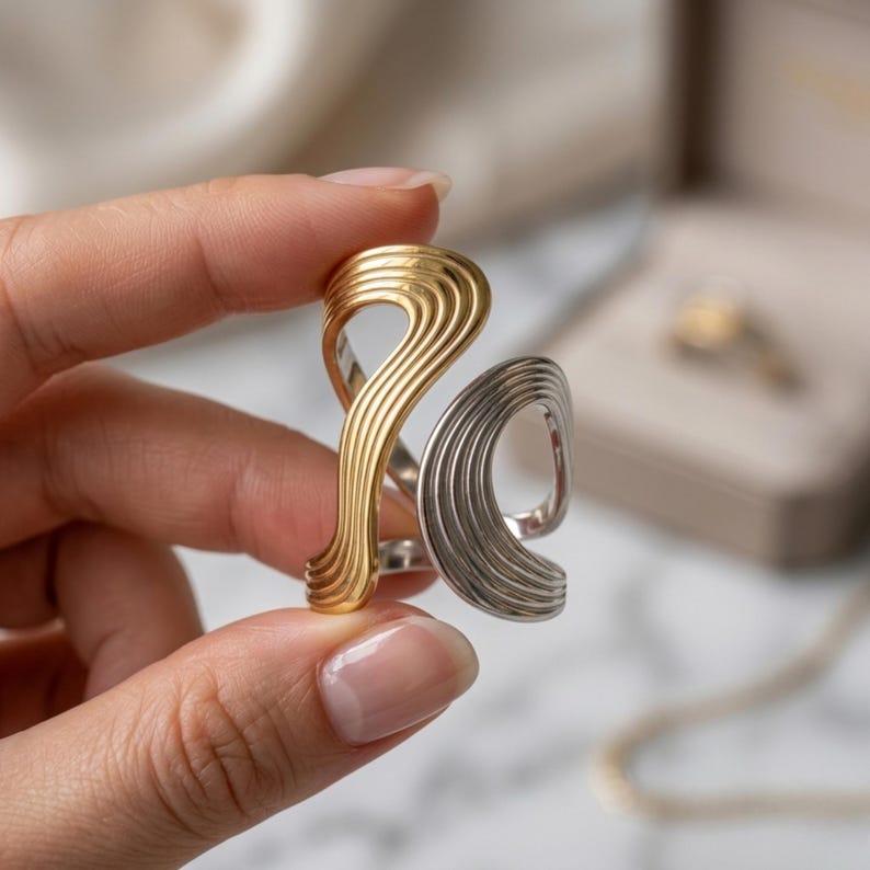 Two Tone Wavy Ring Gold Plated Stainless Steel, Mixed Metal Statement Ring, Adjustable Minimalist Fashion Ring for Women

#TwoToneRing #WavyRing #GoldPlatedRing #StainlessSteelRing #MixedMetalRing #StatementRing #AdjustableRing #MinimalistRing #FashionRingWomen #TrendyRing #EverydayJewelry #StackableRing #GiftForHer #Shipciestore #DualToneRing #MixedMetalRing #TwoToneRing #StatementRing #StainlessSteelRing #OpenRing #AdjustableRing #GoldSilverRing #GiftForHer #SleekRing #ElettraJewelry