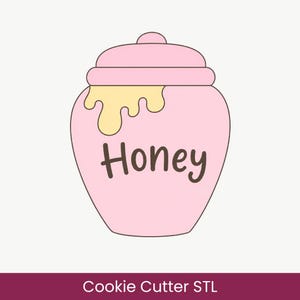 May include: A pink honey pot cookie cutter with a lid and a yellow drip design on the side. The word Honey is written in dark brown script across the center of the pot. The design features a rounded shape with a flat base and a small knob on top.