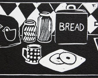 Linocut print kitchen scene, a spring morning breakfast in the kitchen linocut linoblock , black and white , tea , tea cosy , bread bin ,