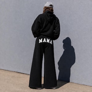 Mama sweatpants back view relaxed wide leg fit, custom mama pants with text on back, unique gift idea for moms, cozy everyday mom outfit, soft fleece sweatpants aesthetic neutral loungewear, comfortable mom sweatsuit set modern minimal style, stay at home mom outfit comfy and cute