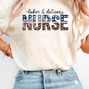 May include: Ivory t-shirt with the text "labor & delivery NURSE" in a patriotic design. The word "NURSE" has a leopard print pattern. The shirt is worn with blue denim shorts. The text "PNG 300 DPI INSTANT DOWLOAD" is at the bottom of the image.