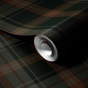 May include: A roll of dark green and brown plaid wallpaper. The pattern features intersecting lines in shades of green, brown, and gray, creating a classic tartan design. The wallpaper is partially unrolled, revealing the rolled-up portion.