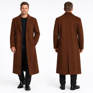 May include: A full-length, brown overcoat with a classic design. The coat features a notched lapel, three-button closure, and front pockets. The model is wearing a black shirt and black pants. The coat is made of a wool blend.