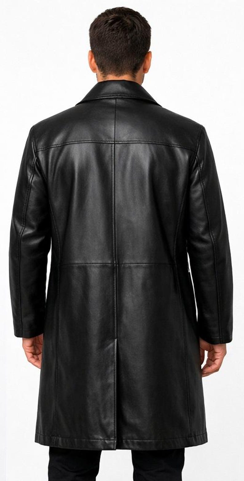 May include: A black leather coat with a classic design. The coat features a notched collar, a button closure, and a long length. The back of the coat has a center vent and vertical seams for a tailored fit. The coat is made of a smooth, shiny leather.