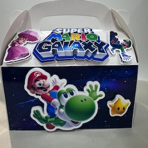 white party box with a handle, featuring a galaxy theme with super Mario, princess peach and Rosalina, yoshi, luma, Luigi and bowser jr as wonder. The box is decorated with  3D characters. The box is designed for party favors. includes Mario stickers