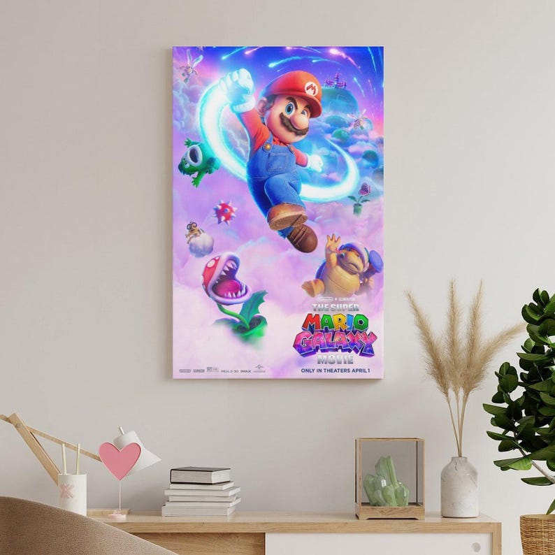 May include: A framed movie poster for "The Super Mario Bros. Movie." The poster features Mario in a dynamic pose, surrounded by animated characters and a vibrant, colorful background. The movie title is prominently displayed.