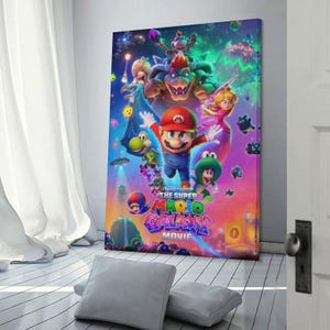 May include: A colorful canvas print featuring characters from "The Super Mario Galaxy Movie." Mario, Bowser, Princess Peach, and other characters are depicted in a vibrant, action-packed scene. The title of the movie is prominently displayed in a stylized font.