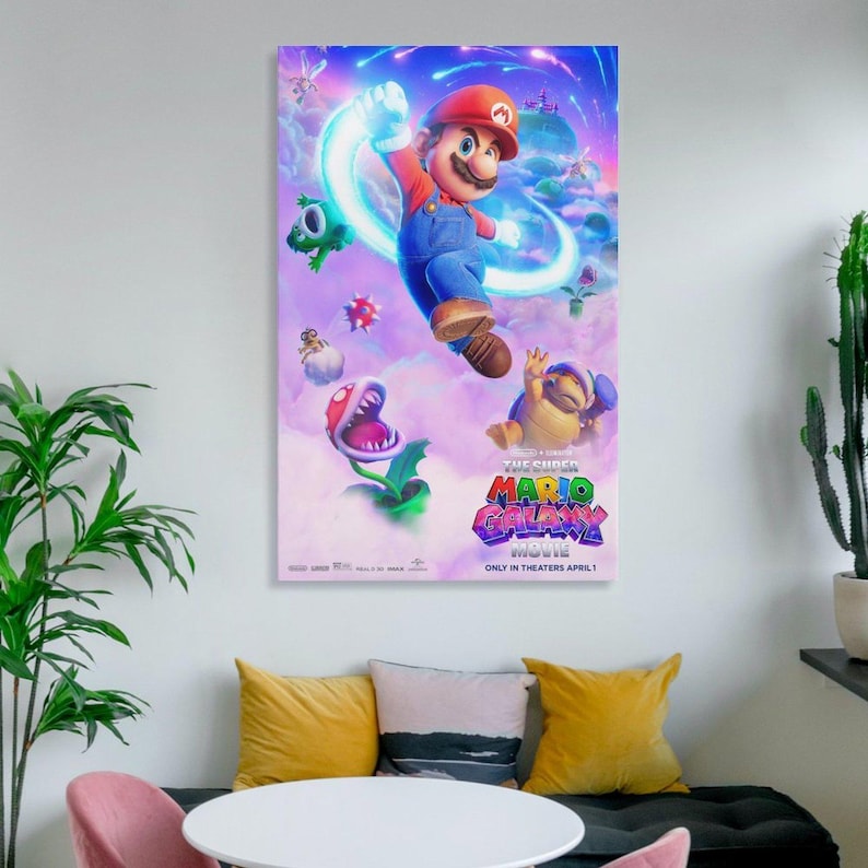 May include: A framed movie poster for "The Super Mario Bros. Movie" featuring Mario in a red cap and blue overalls, jumping with a glowing energy effect. Other characters include a Piranha Plant and a Koopa Troopa. The poster is set against a purple and blue background.