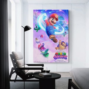 May include: A framed poster for "The Super Mario Bros. Movie" featuring Mario in a red cap and blue overalls, surrounded by colorful characters and a vibrant, cosmic background. The movie title is prominently displayed.