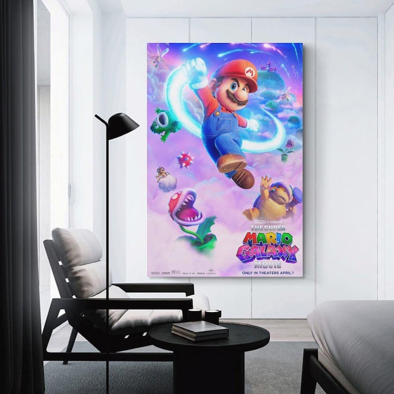 May include: A framed poster for "The Super Mario Bros. Movie" featuring Mario in a red cap and blue overalls, surrounded by colorful characters and a vibrant, cosmic background. The movie title is prominently displayed.