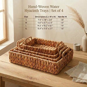 May include: A white ceramic mug with a black handle and the text "But First, Coffee" in a bold, black font. The mug is sitting on a wooden surface. The mug is approximately 4 inches tall.