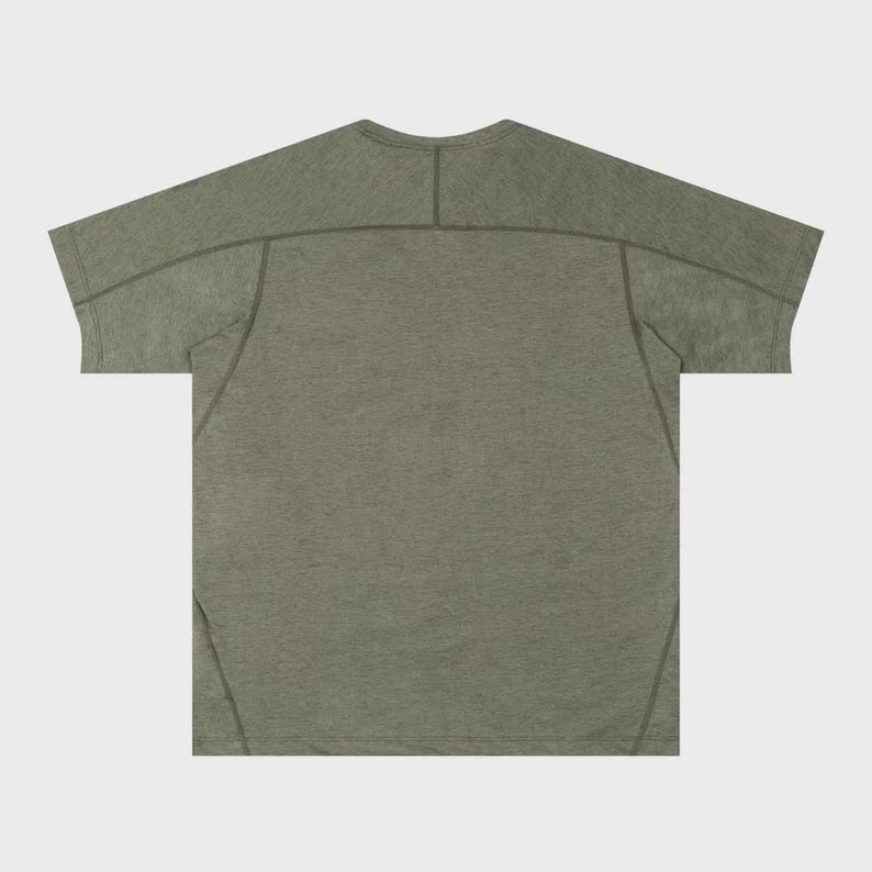 May include: Olive green t-shirt with a crew neck and short sleeves. The shirt has a textured appearance and features visible stitching details along the shoulders and sleeves. The back of the shirt is visible.